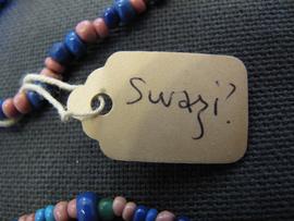 Oval label tied to object