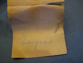 Brown paper label (view 3)