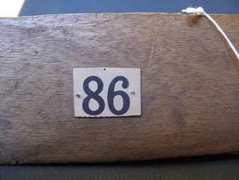 Brown paper label attached to object