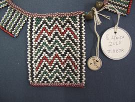 Ornament detail and circular labels with metal outline tied to object