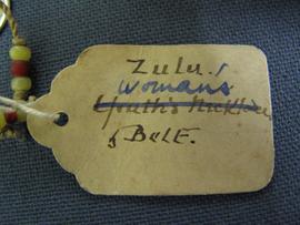 Oval paper label tied to object