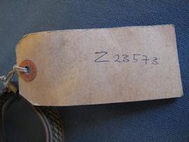 Rectangular brown paper label tied to object (02)